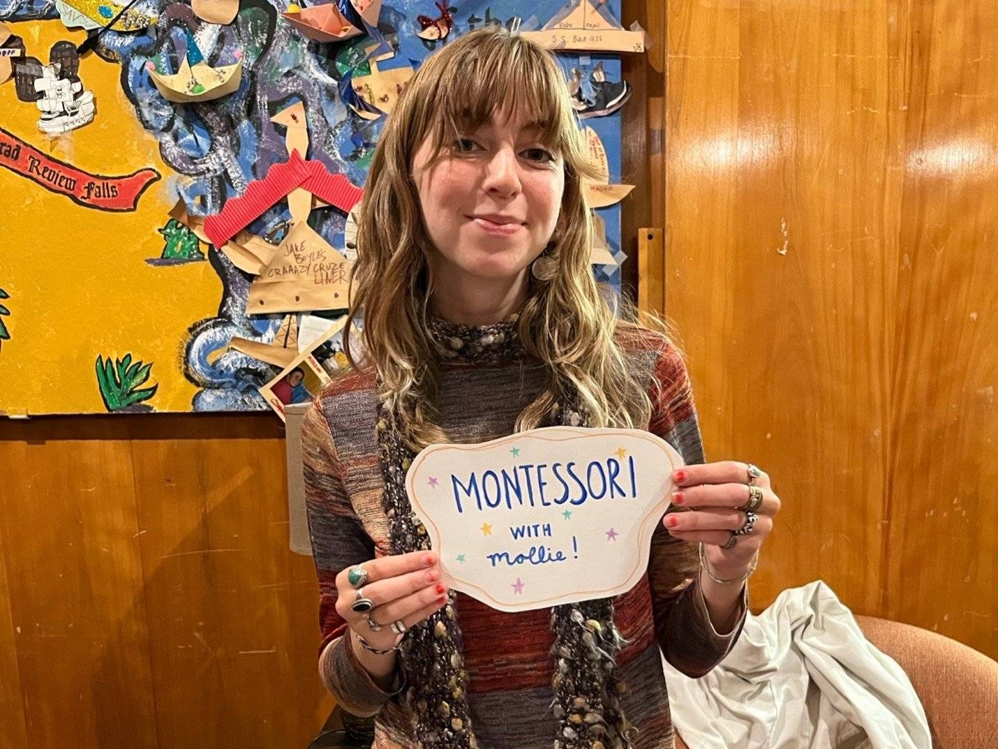 a woman holding a sign