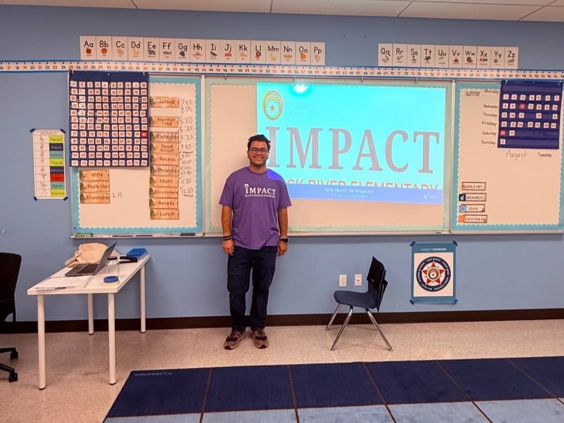 a man standing in front of a whiteboard
