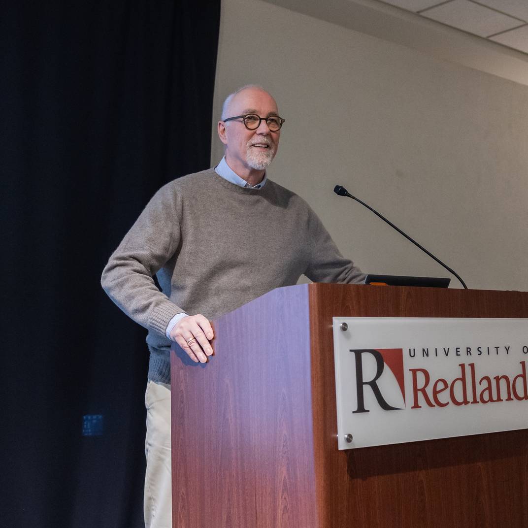 a man standing at a podium