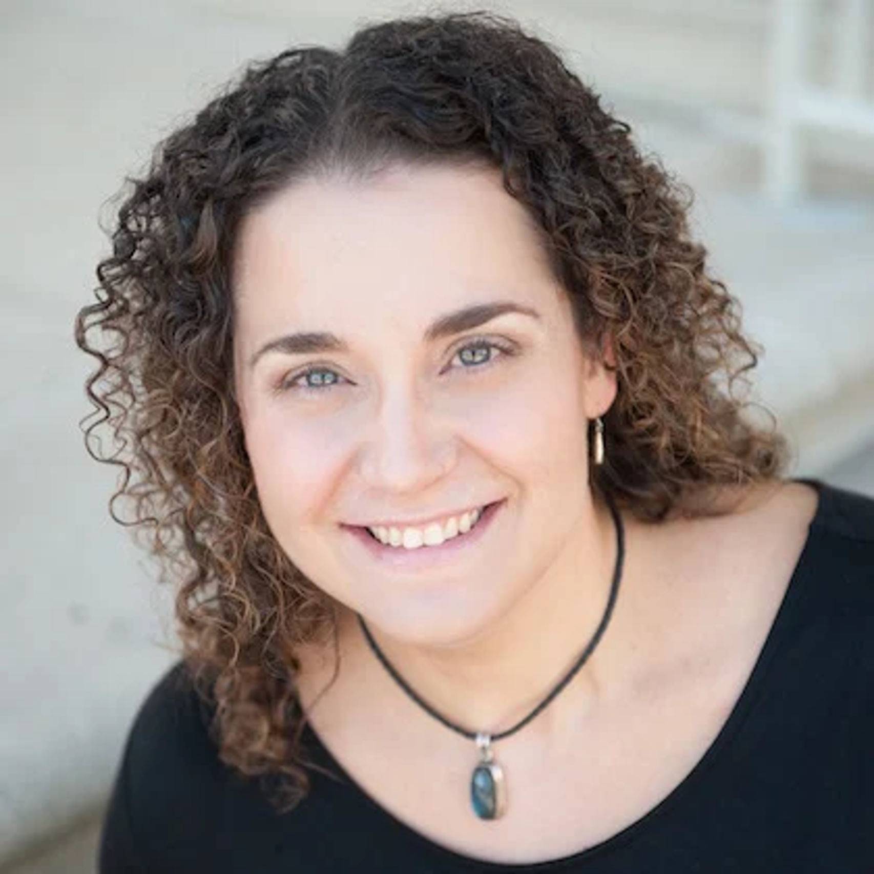 a woman smiling at camera