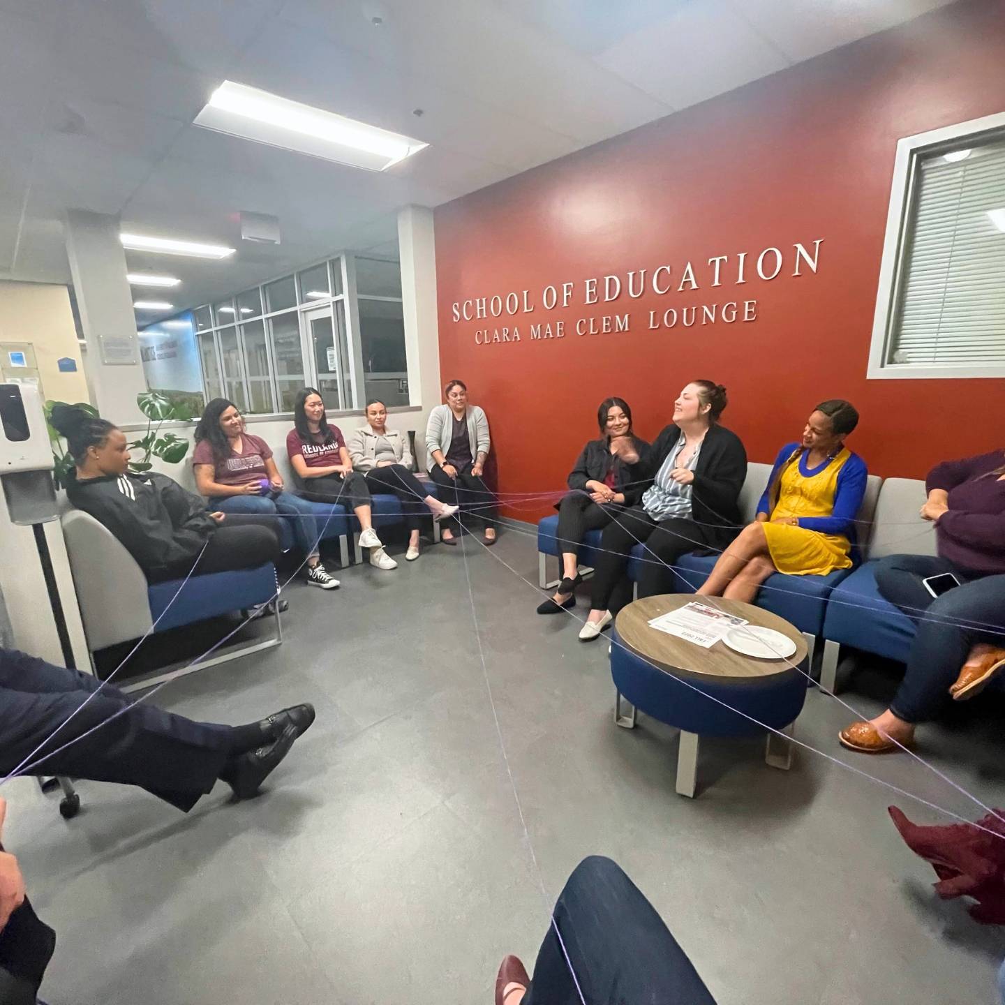 a group of people sitting in a circle