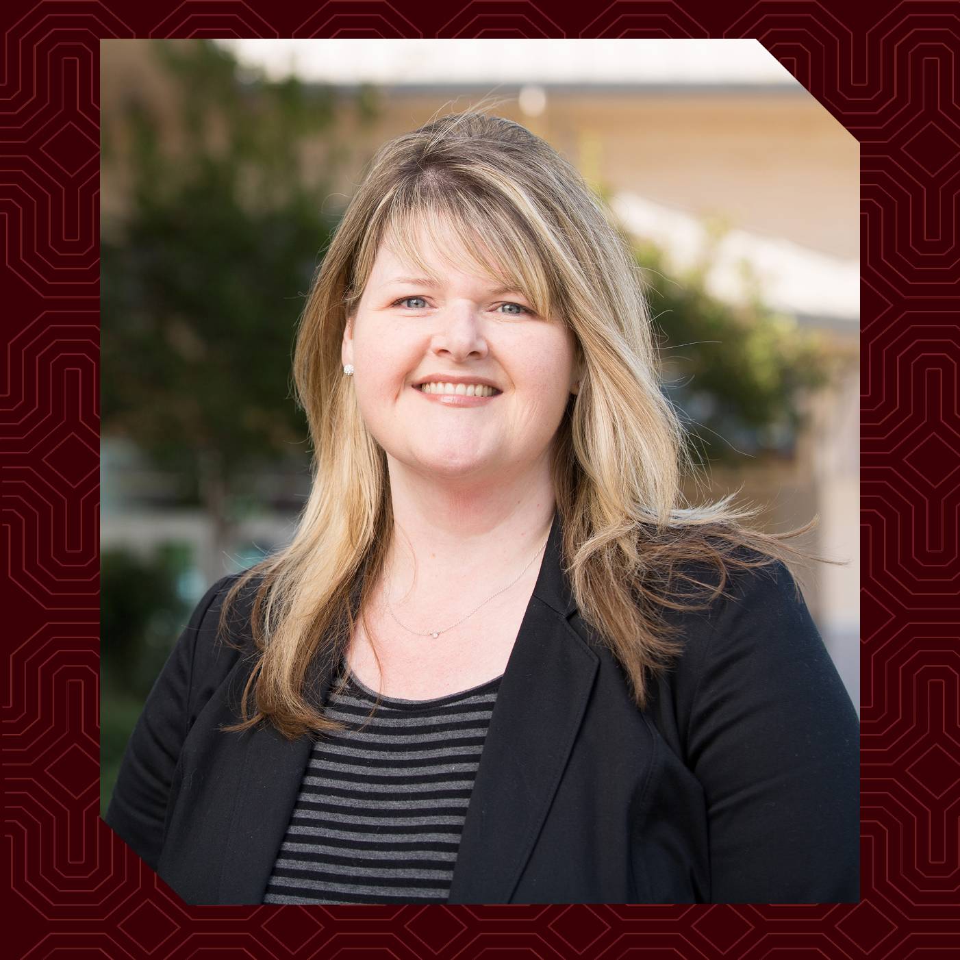 a woman smiling for a picture