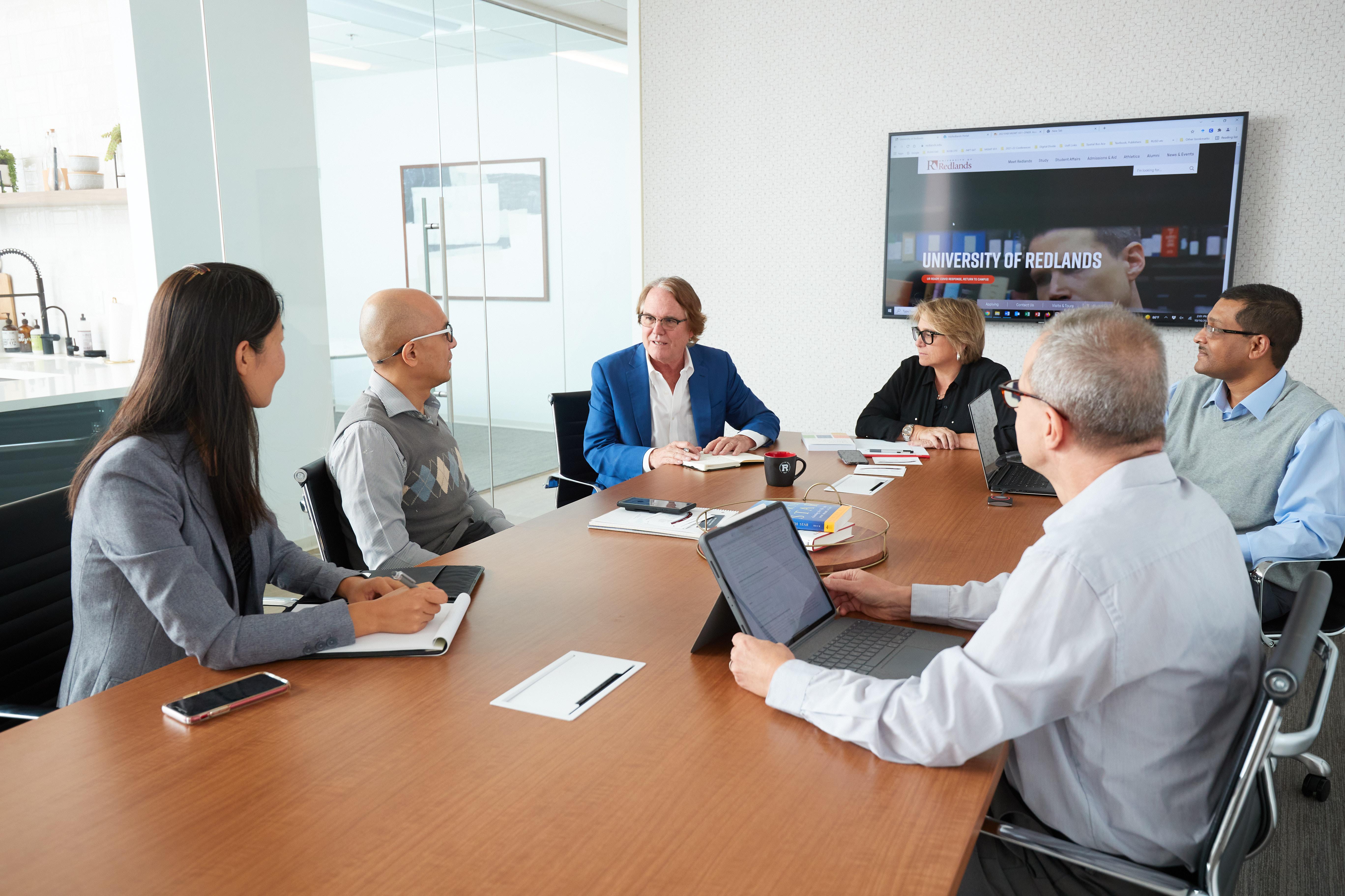 a group of people sitting around a table
