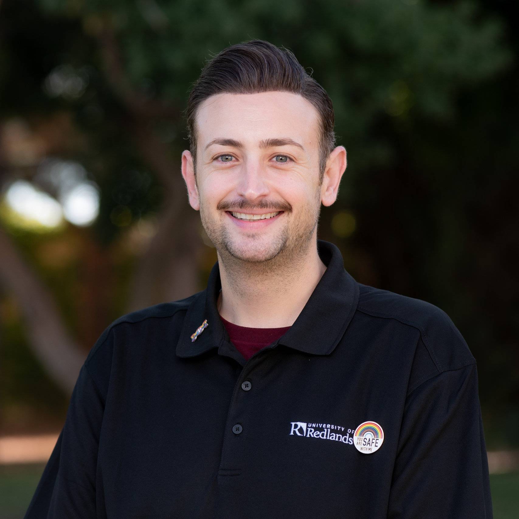 a man smiling for a picture
