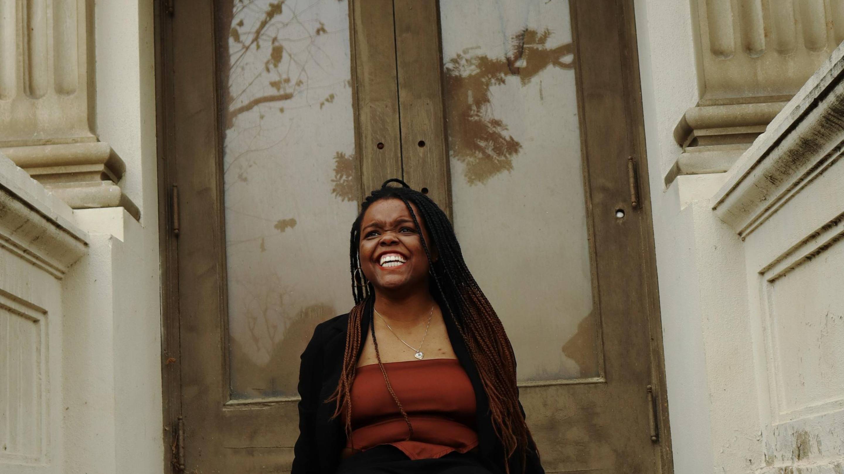 a woman sitting on a bench