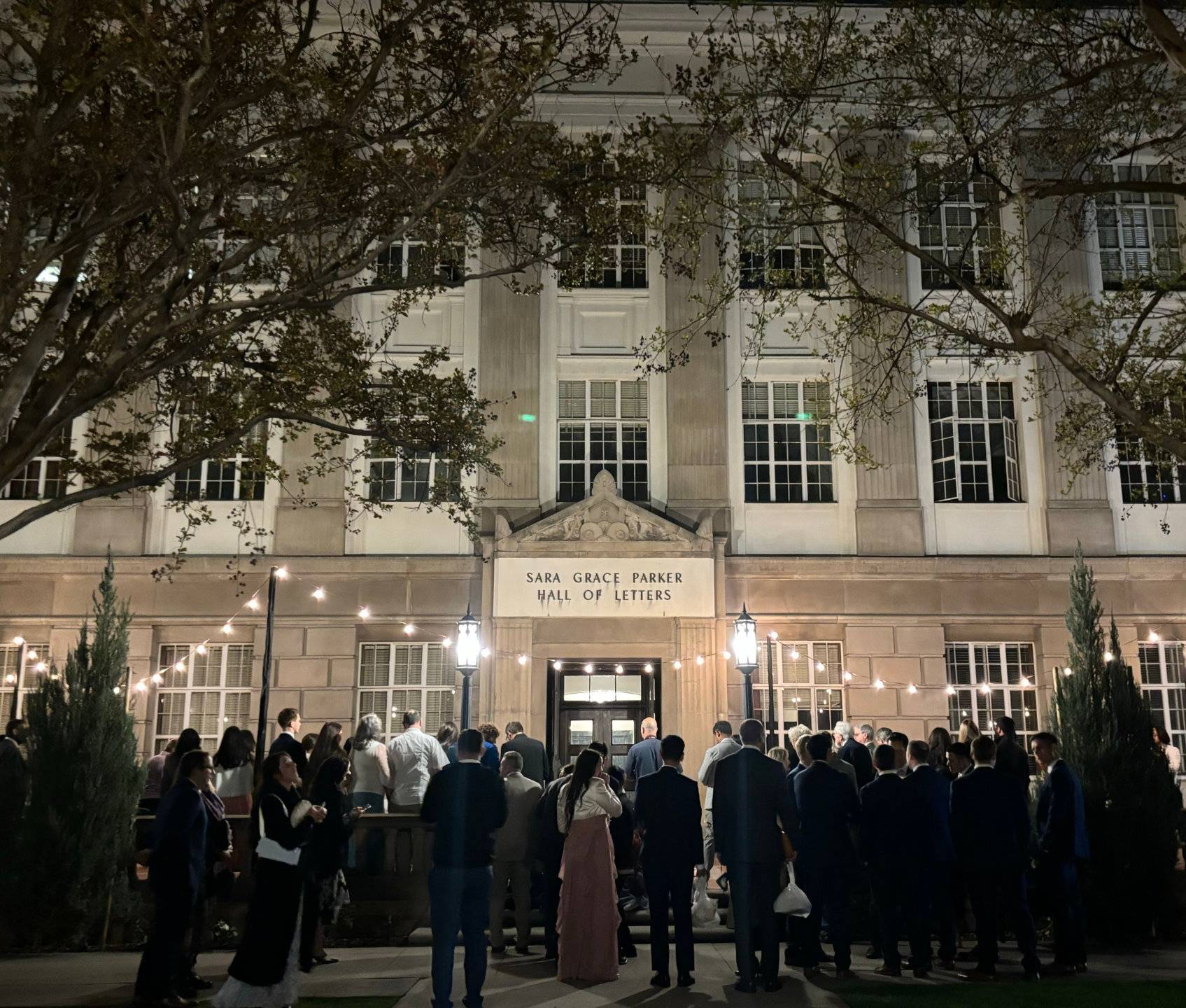a group of people outside of a building