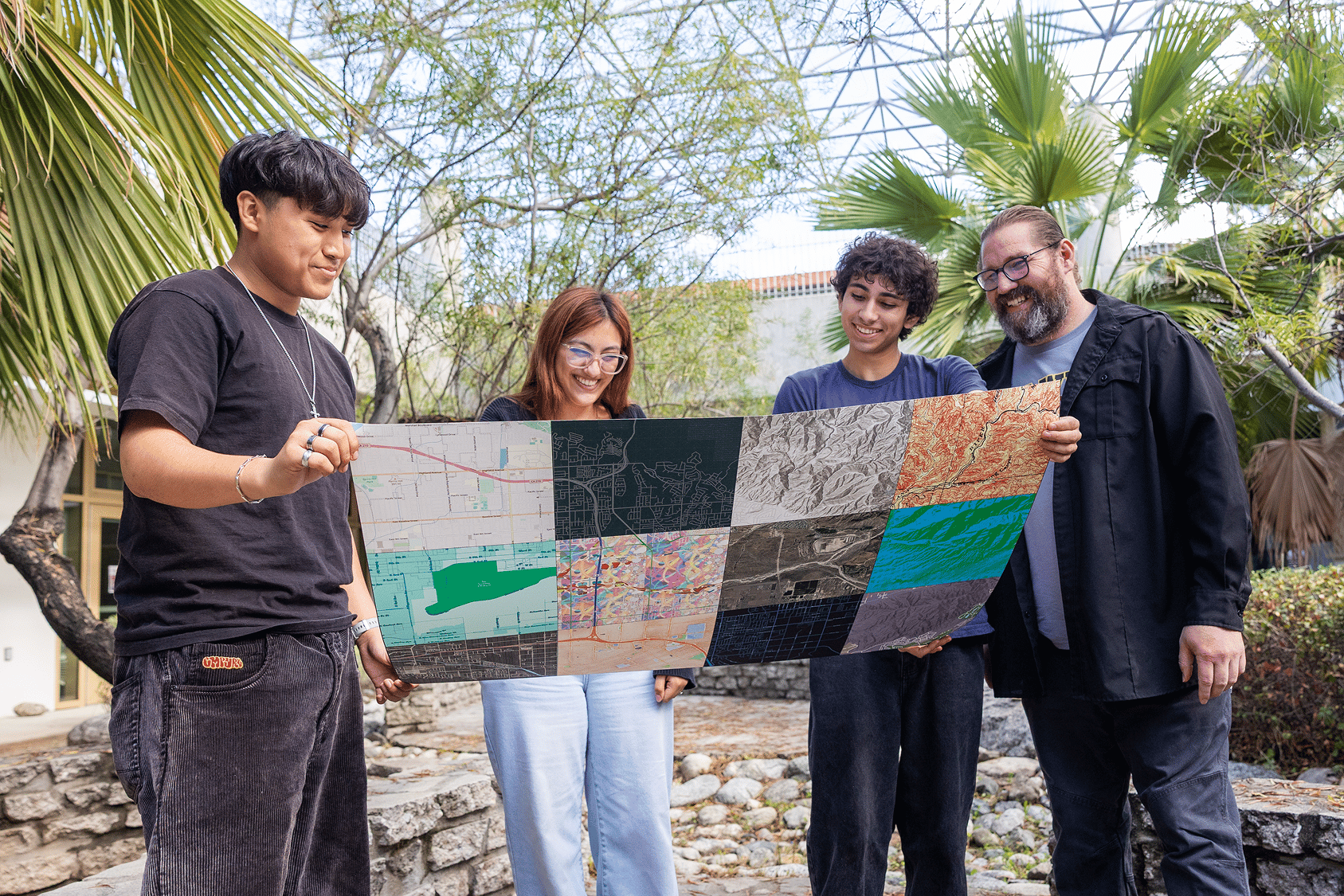 a group of people holding a map