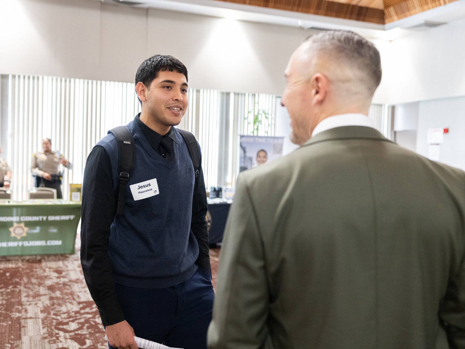 a man talking to another man