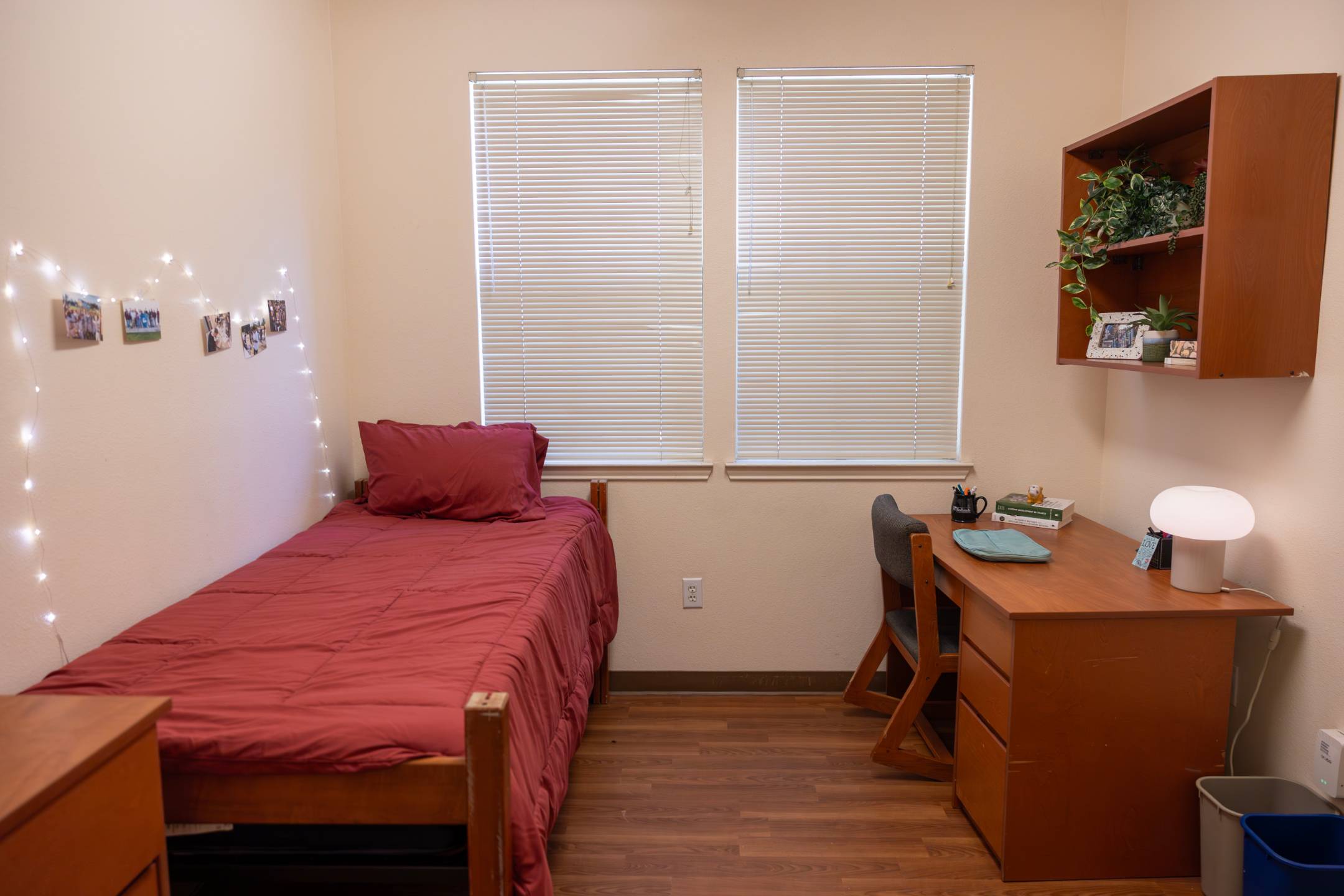 a bedroom with a bed and desk