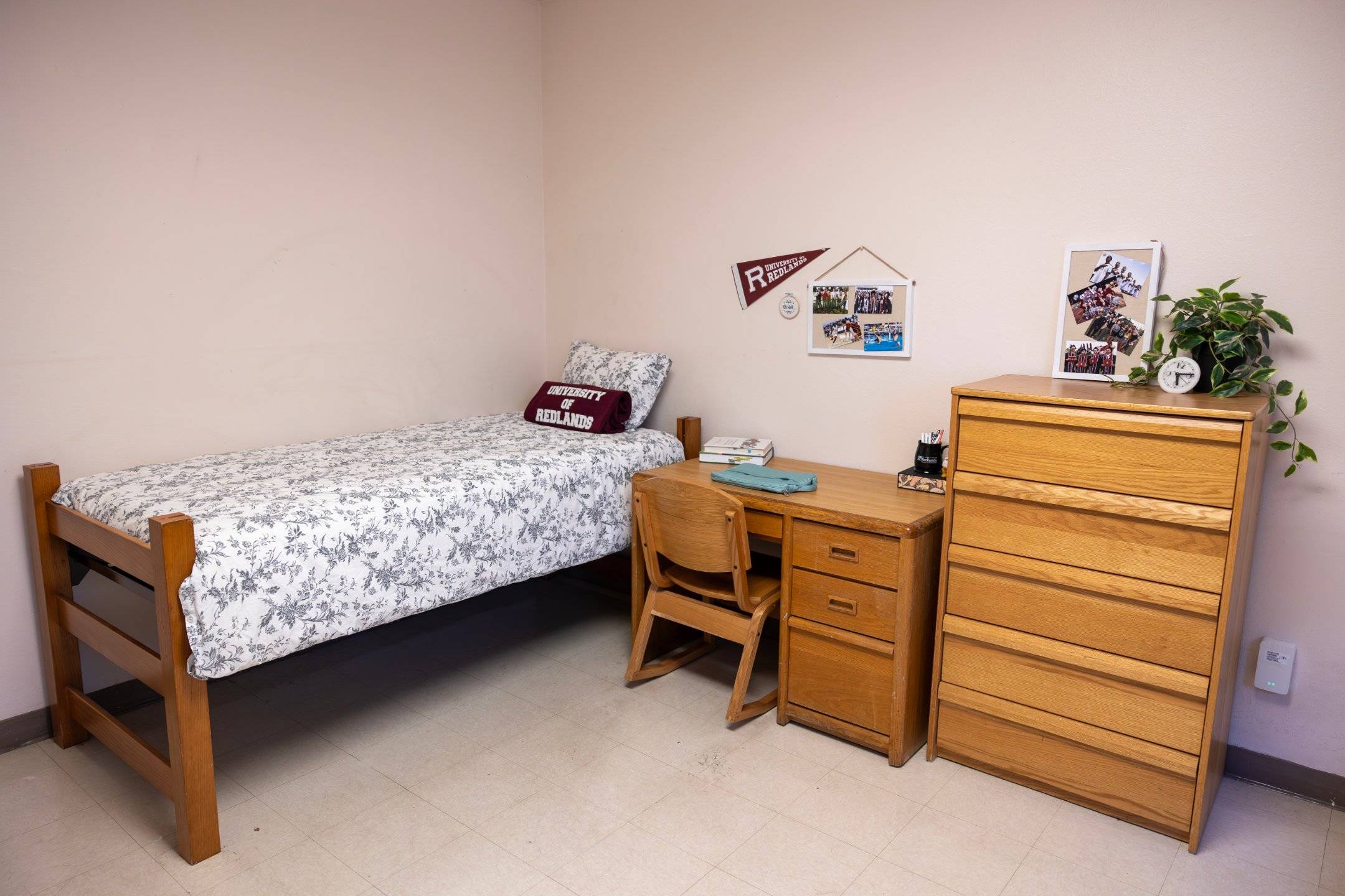 a bedroom with a bed and desk