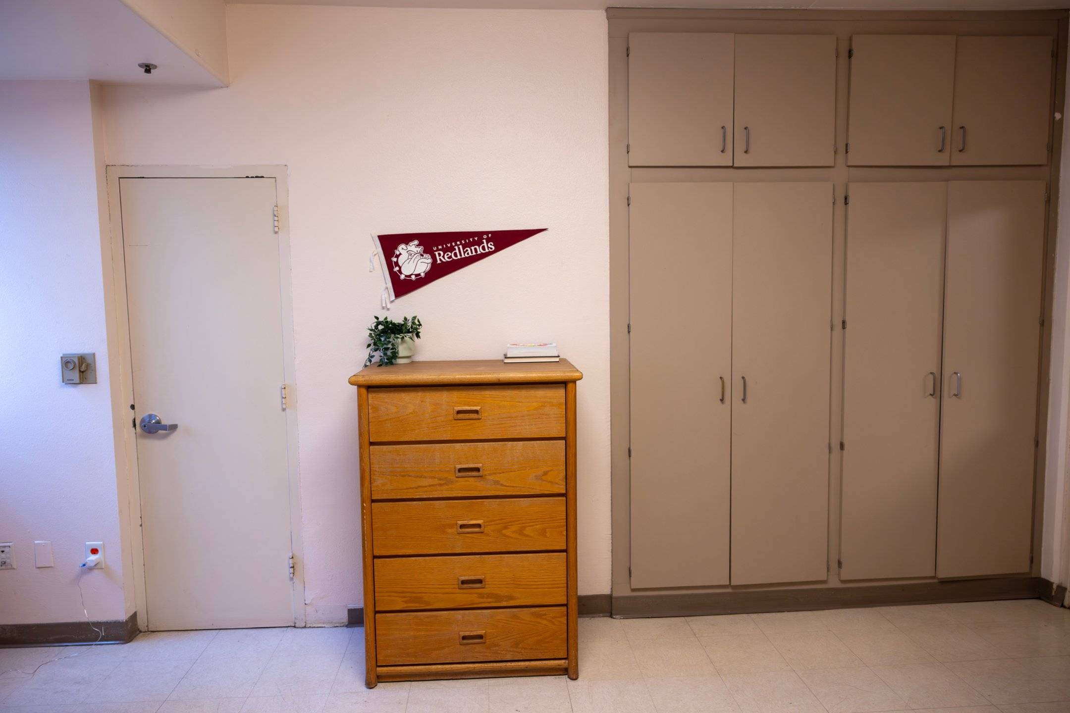 a wooden dresser in a room