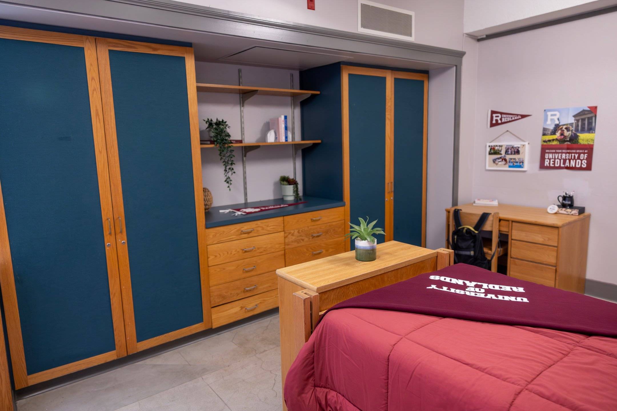 a room with a bed and a desk