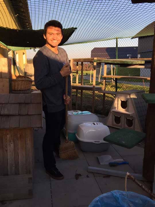 a man holding a broom