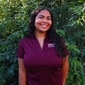 a woman in a maroon shirt