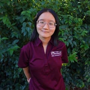 a woman in a maroon shirt