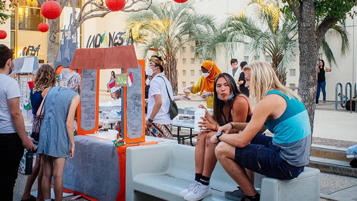 a group of people sitting on a bench