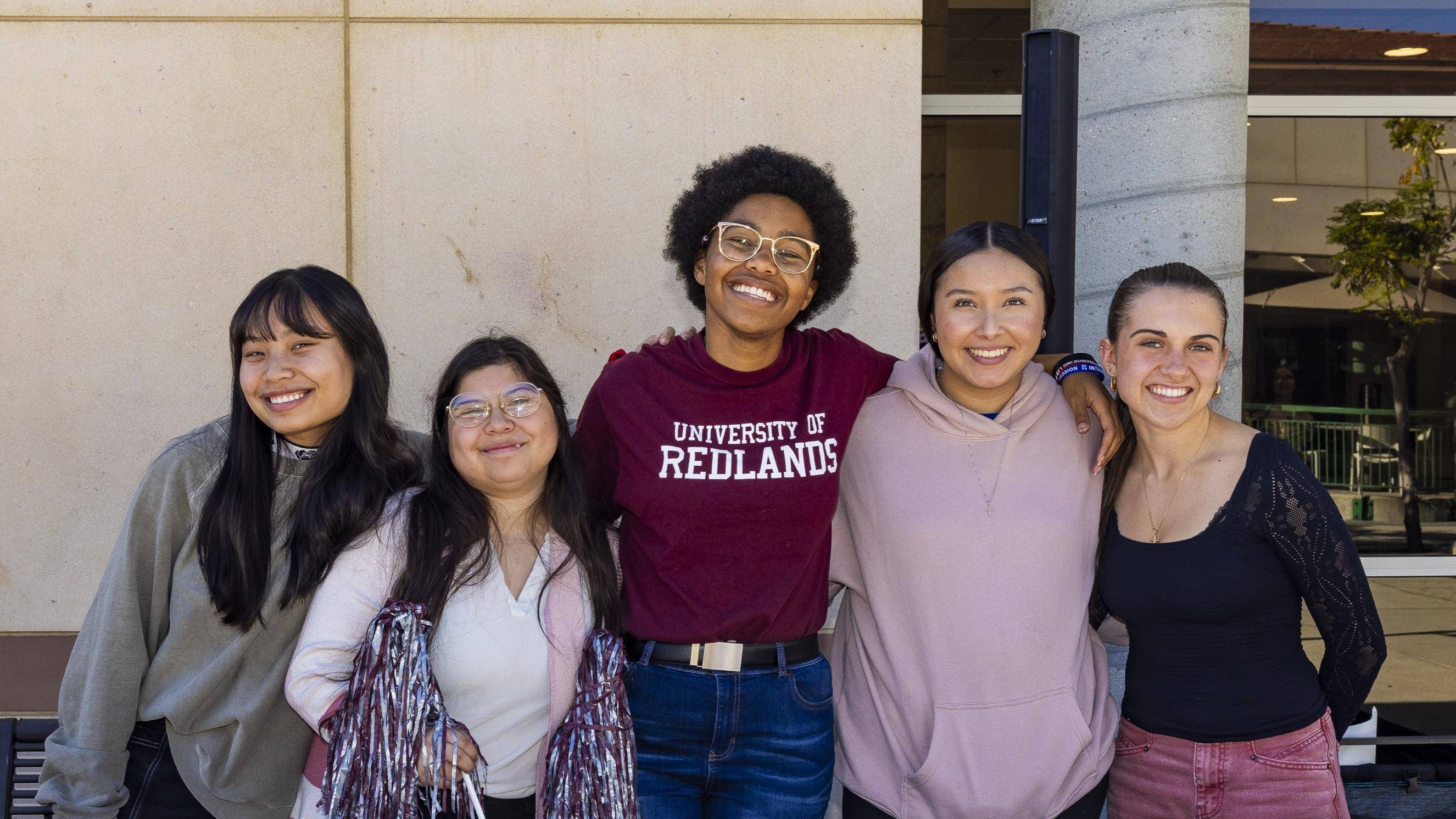a group of women posing for a photo