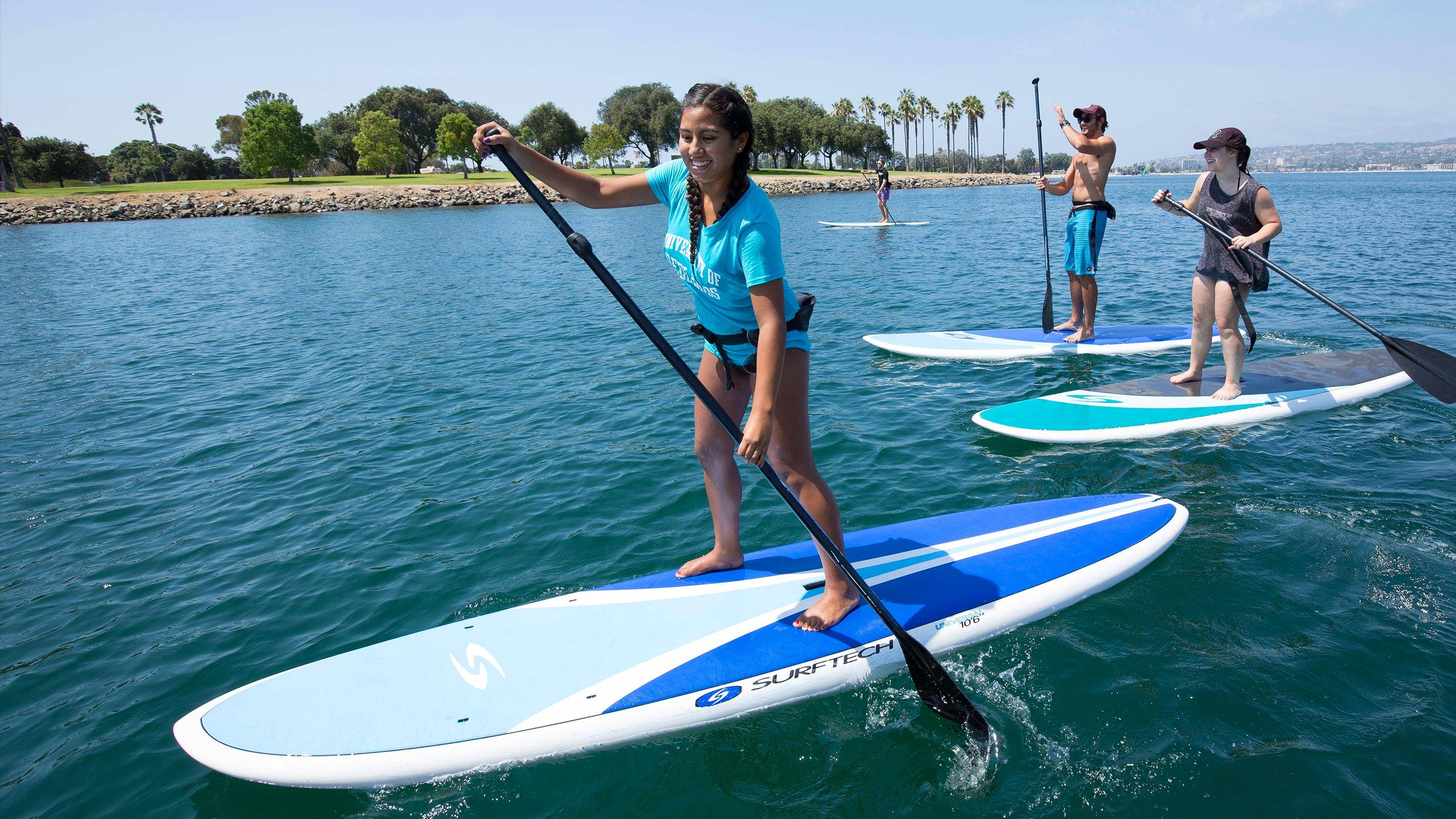 a woman on a paddle board