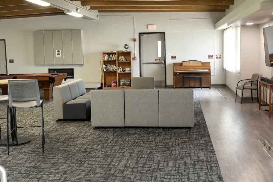 a room with a piano and couch