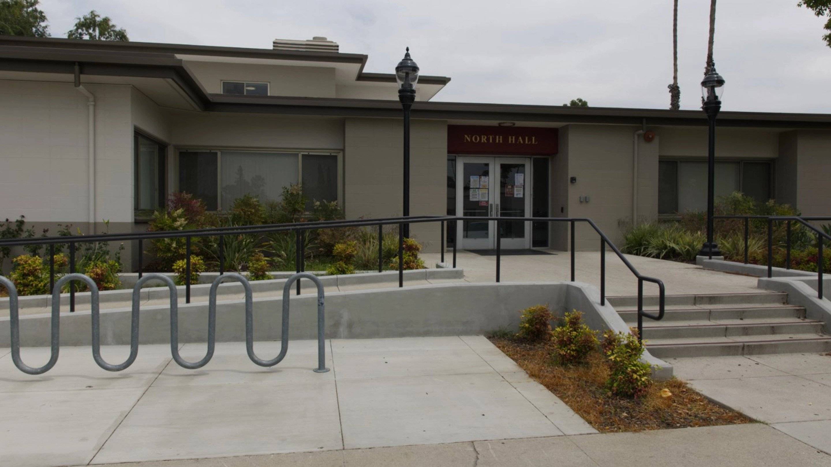 a building with a railing and a lamp post