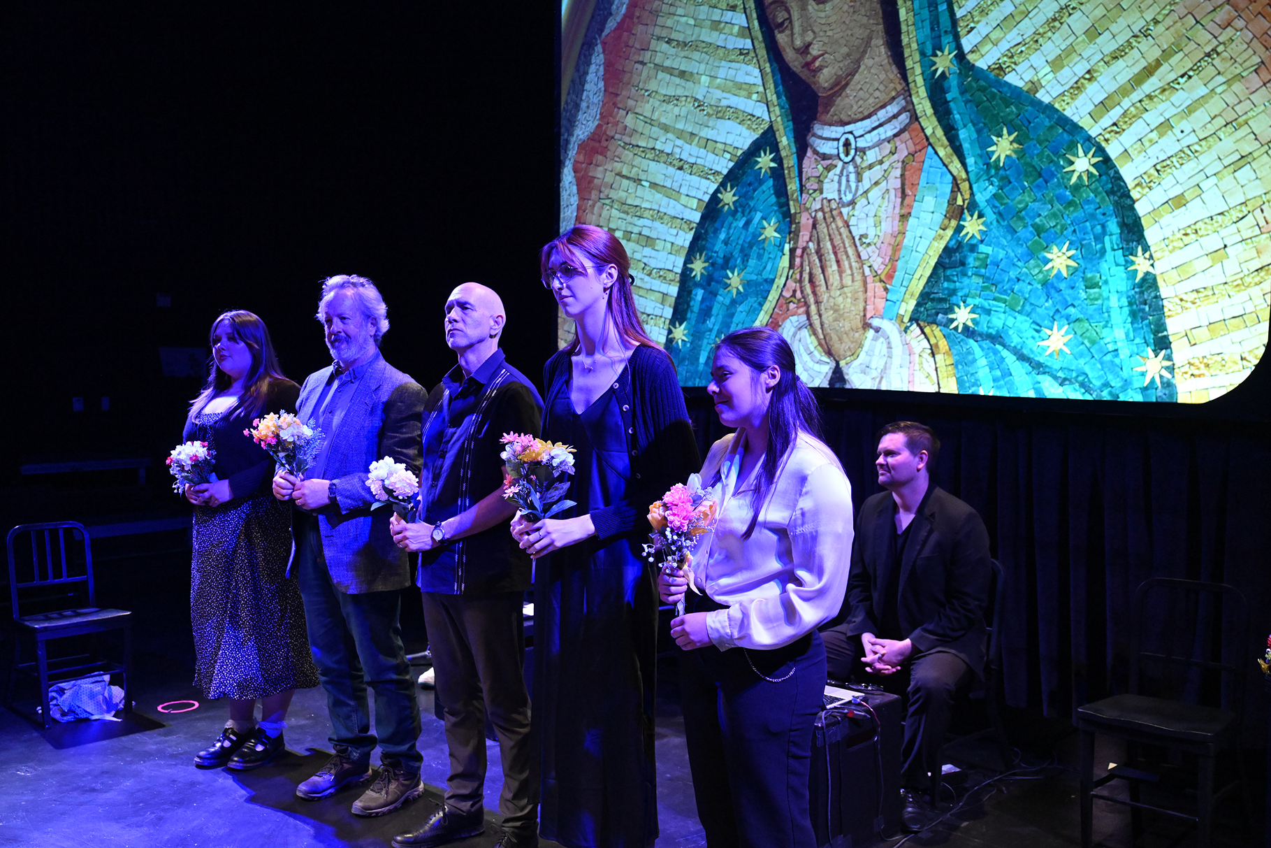 a group of people holding flowers