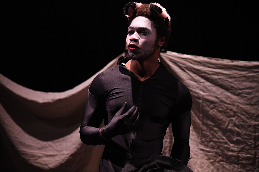 a man in garment with ears on his head