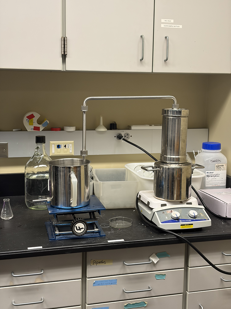 a laboratory with a machine and a container