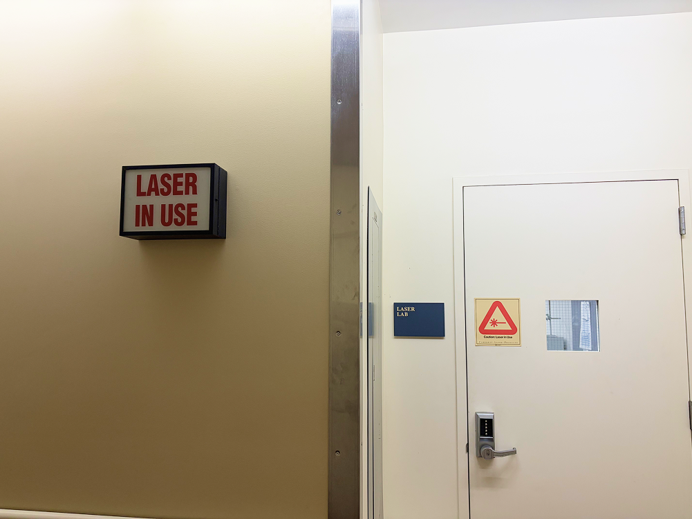 a white door with a red sign on it