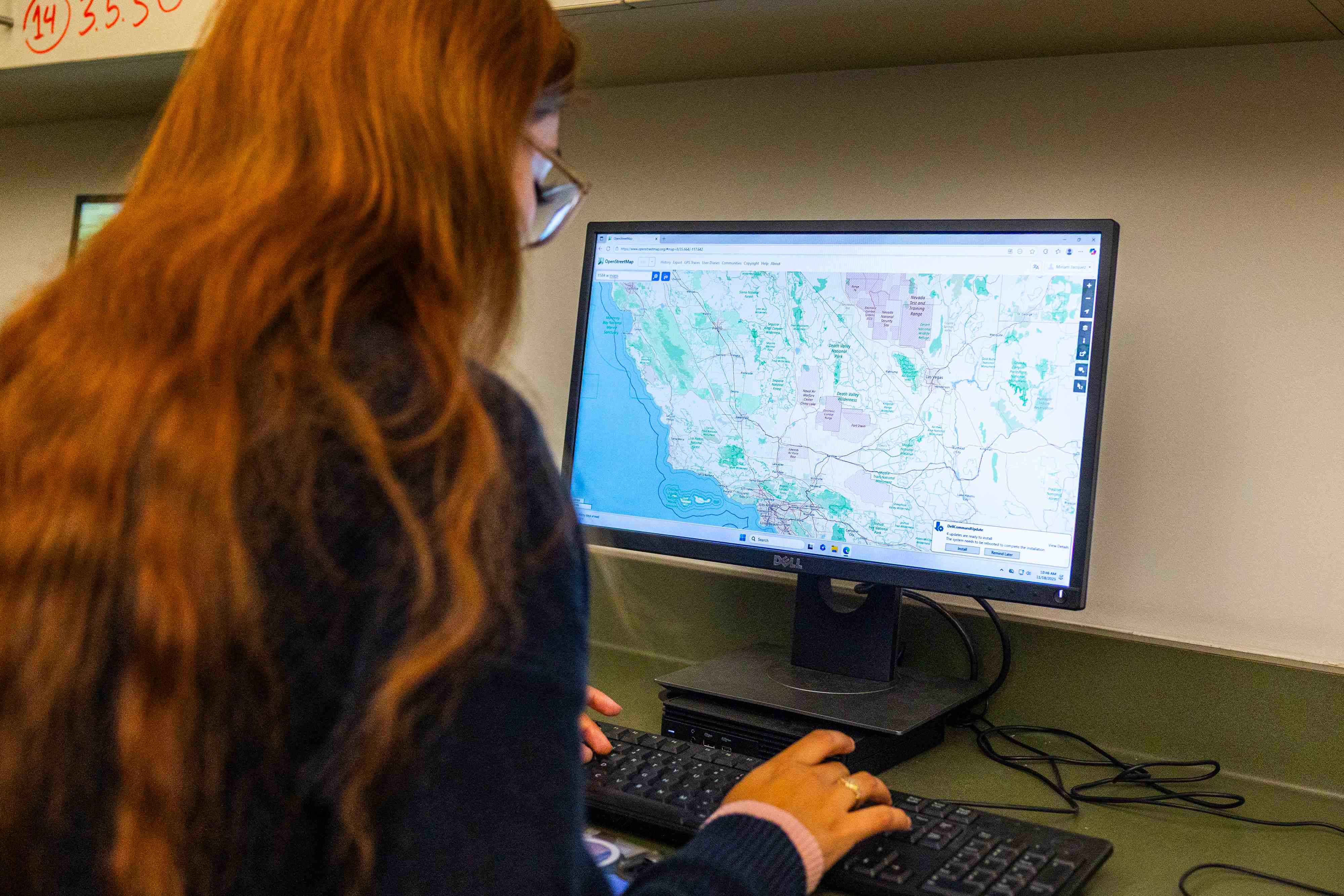 a woman sitting at a computer