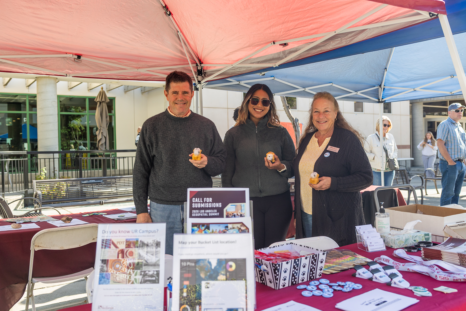 a group of people standing under a tent
