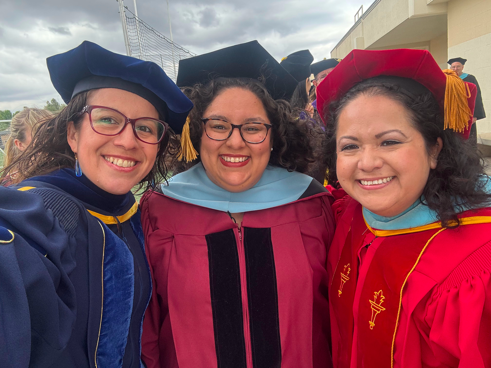a group of women in graduation gowns